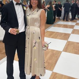 Equipment sleeveless silk midi dress with seam pockets and a mock collar.